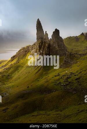 The breathtaking Old Man of Storr pinnacles on the Isle of Skye with dark moody clouds in background. Stock Photo