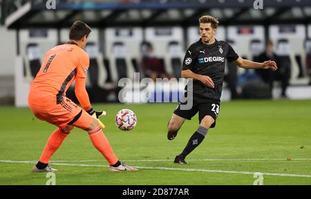 Jonas Hofmann Of Monchengladbach And Thibaut Courtois Of Real Madrid ...