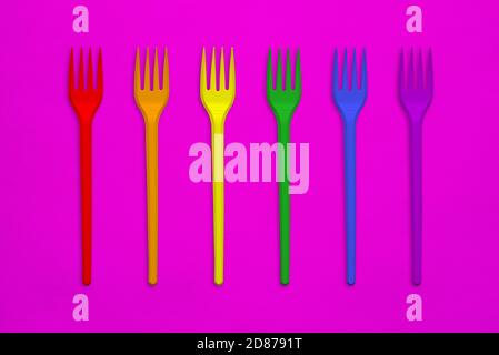 Plastic forks in the colors of the rainbow flag. LGBT Concept Stock Photo