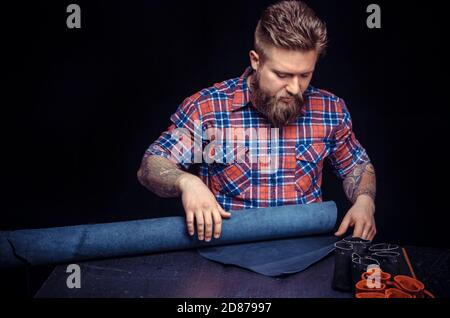 Leather Artist producing a good product Stock Photo