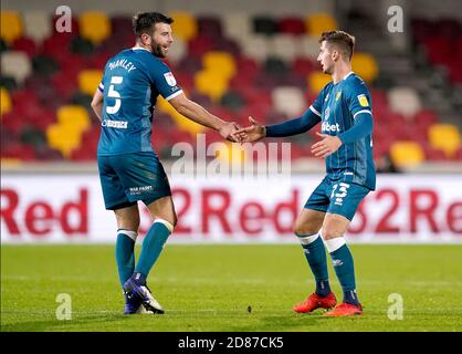 Norwich City's Kenny McLean (right) celebrates scoring his side's first goal of the game with teammate Grant Hanley during the Sky Bet Championship match at the Brentford Community Stadium, London. Stock Photo