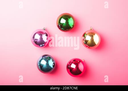 Christmas New Year composition. Gifts, colorful ball decorations on pink background. Winter holidays concept. Flat lay, top view Stock Photo