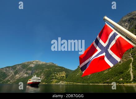 Ship MS Polarlys, Norwegian flag, Geiranger, Møre og Romsdal, Norway, Scandinavia, Europe, adventure trip, flags, tourism, Hurtigruten, Hurtigruten vo Stock Photo