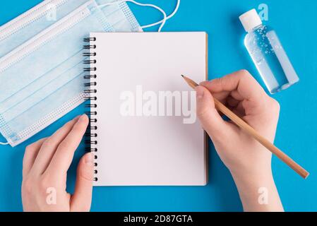 Strategy schedule wiring concept. Pov top view overhead above close up view photo of female hands holding pen writing message steps to stay healthy to Stock Photo