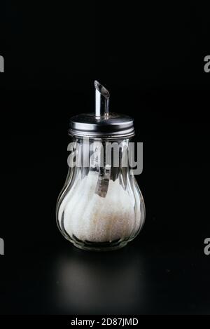 transparent sugar bowl on black background Stock Photo