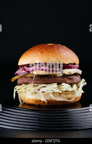 American craft juicy burger on black background Stock Photo