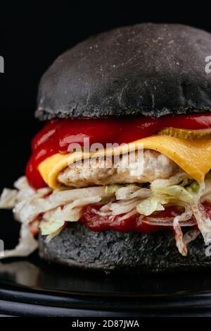 American craft juicy burger on black background Stock Photo