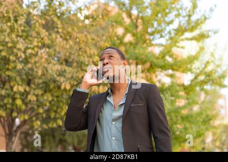 young stylish african man in the city talking from mobile phone Stock Photo