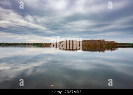 Island on lake with fall colors Stock Photo