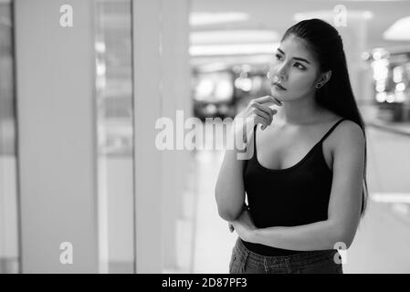 Young beautiful Asian woman exploring around the city Stock Photo