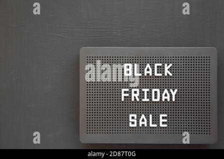 'Black Friday Sale' words on a black lightbox on a black background, top view. From above, overhead. Space for text. Stock Photo