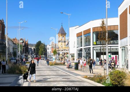 Eastbourne High Street and The Beacon Shopping Centre on Terminus Road looking towards railway station clock tower.  East Sussex, England, UK Stock Photo