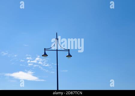 Lamp post against blue sky and clouds, Eastbourne, East Sussex, England, UK Stock Photo
