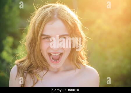 Excited teenagers face close up. Hipster teen girl face with open mouth. Happy Summer. Stock Photo