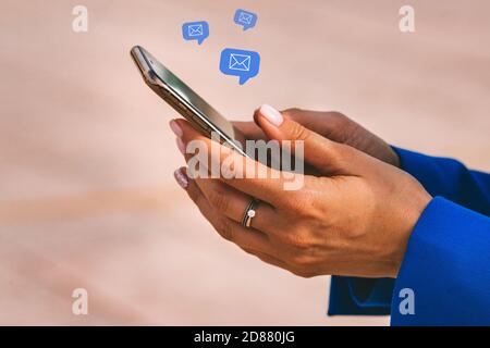 Woman hands with mobile phone. New messages on smartphone. E-mail communication Stock Photo