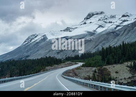 Snow-capped mountains in late autumn season. Seen from the Icefields Parkway (Alberta Highway 93), Jasper National Park, Canada. Stock Photo