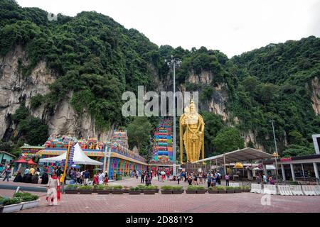 Batu Caves, Malaysia - 7 September, 2018: New iconic look with colorful stair and unidentified visitors at Murugan Temple Batu Caves, Malaysia. - The Stock Photo