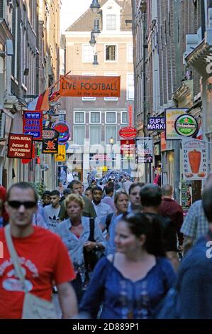 Mass tourism overtakes Lange Niezel in Amsterdam, Holland, in 2011, one of the reasons for the city Project 1012. Stock Photo