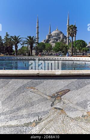 Completed in 1616, The Blue Mosque in Istanbul, Turkey as viewed from Sultanahmet Square where a tiled mosaic of a whirling dervish is on display. Stock Photo