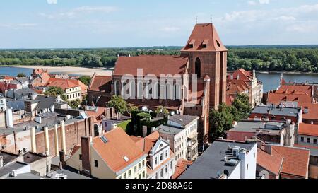 The gothic old town of Torun, Poland, is known for the brick gothic Cathedral of Torun near the Vistula River. Stock Photo