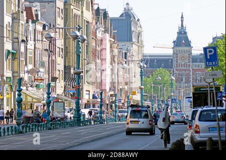 Busy Damrak in Amsterdam, Holland, leading towards Amsterdam Centraal Station in 2011. Stock Photo