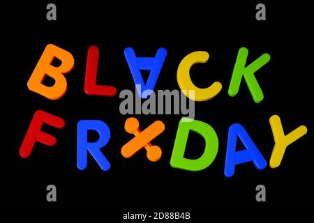 Black friday. Multi colored letters against black background Stock Photo