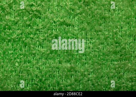 Light green fluffy background of thread. Terry fabric texture close-up. Stock Photo