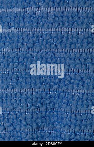 Fabric blue striped background. Soft fiber texture polyester close-up. fine grain fabric. Stock Photo