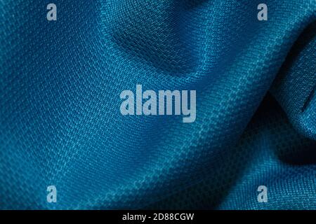 Blue crumpled fabric background. Abstract texture, empty template. Selective focus. Stock Photo