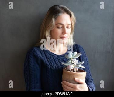 woman holding a succulent plant pot Stock Photo