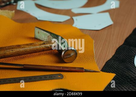 Tools of shoemaker on the table in workshop Stock Photo