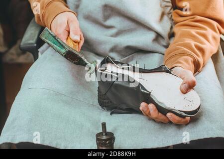 Close up of shoemaker making shoe Stock Photo