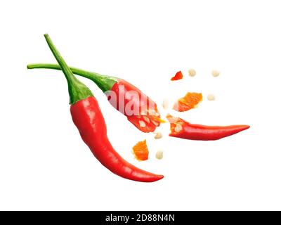 Seed burst out from red chili pepper over white background Stock Photo