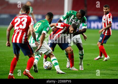 Jorge Resurreccion 'Koke' of Atletico de Madrid fight for the ball with William Carvalho and Nabil Fekir of Real Betis during the Spanish championsh C Stock Photo