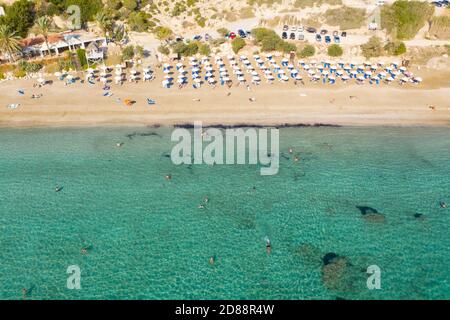 Aerial view of people swimming in the clear water of Coral Bay, Peyia, Cyprus Stock Photo