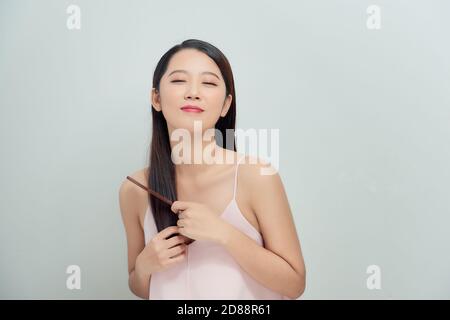 bright picture of beautiful woman with comb Stock Photo