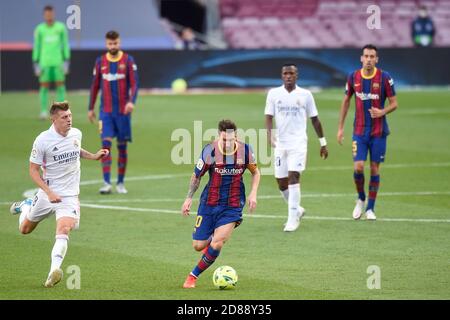 Lionel Messi of FC Barcelona and Toni Kroos of Real Madrid during the La Liga match between FC Barcelona and Real Madrid played at Camp Nou Stadium on October 24, 2020 in Barcelona, Spain. (Photo by Sergio Ruiz/PRESSINPHOTO) Credit: Pro Shots/Alamy Live News Stock Photo