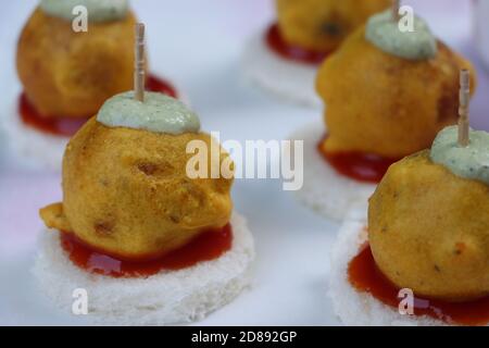 Mini vada Pav, restaurant style version of  roadside fast food dish from Maharashtra, India, starter or appetizer Stock Photo