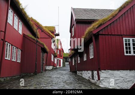 Turf roofs on the parliament buildings in the Tinganes quarter of the Faroese capital Torshavn. Stock Photo
