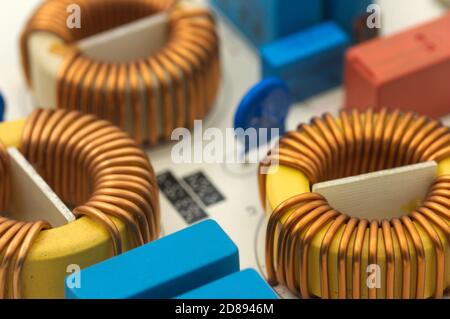 Close-up of some coils among other elements of an electronic circuit of a motherboard Stock Photo