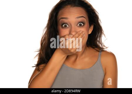 portrait of young shocked woman on white background Stock Photo