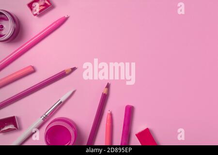 Artist workplace with watercolors, gouache, acrylic, brush, pencils, pastel on blue isolated background. Creative background scene. Flat lay. Top view Stock Photo