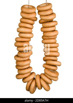 Sheaf of tasty bagels isolated on white background Stock Photo