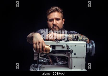 Leather Currier at work on his new leather product in studio Stock Photo