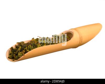 Oolong tea in bamboo scoop isolated on white background Stock Photo