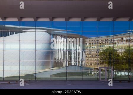 Luxembourg, Luxembourg City, Kirchberg, Place de l’Europe. The Philharmonie - Philharmonic Hall reflecting in the European Convention Center Stock Photo