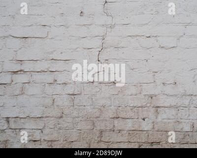 White cracked brick wal background, painted surface texture Stock Photo