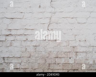 White cracked brick wal background, painted surface texture Stock Photo