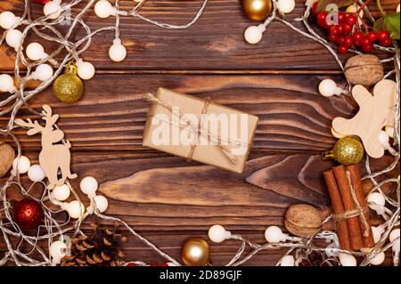 Rustic gift box on wooden background.Christmas gift on wooden board Stock Photo