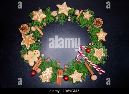 Christmas background with fir tree, festive decoration on dark board Stock Photo